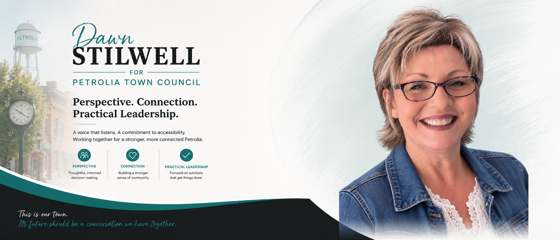 Dawn Stilwell smiling, wearing glasses and a denim jacket